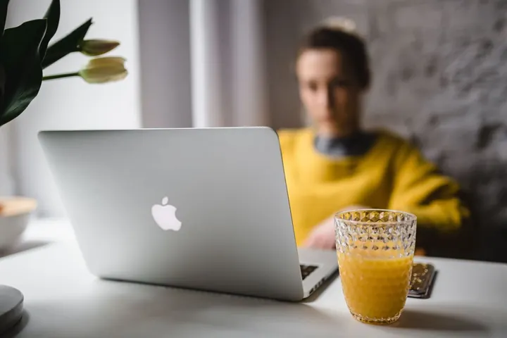 Person working on a laptop while contacting the MerkleBot team