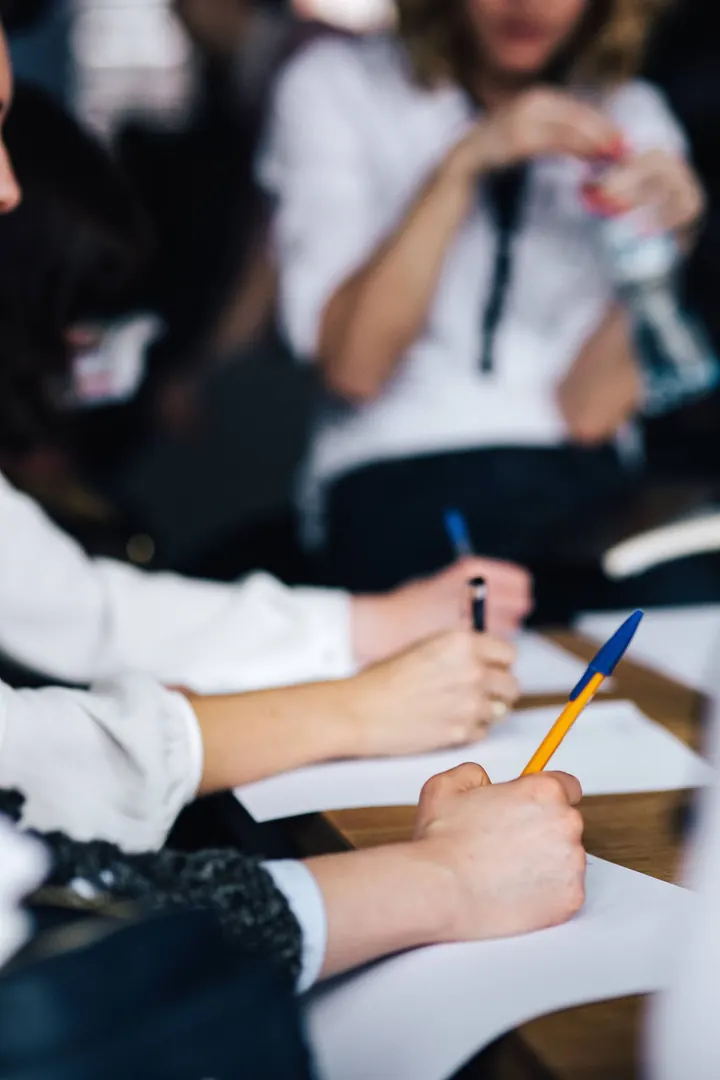 Team members taking notes during a planning session